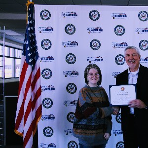 Student accepting certificate